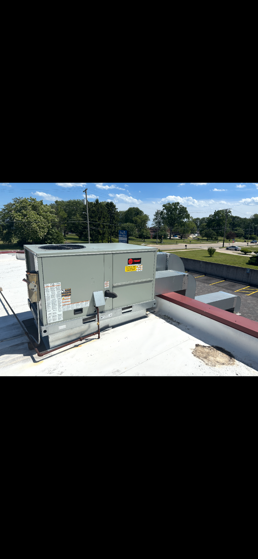 Commercial rooftop unit — side view with ductwork